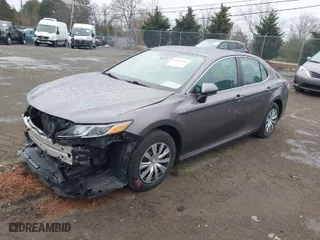 2021 Toyota Camry Hybrid LE with VIN 4T1C31AK4MU557997, listed as a IAAI auction lot 41863503 with 121,270 mi miles. Bid and sale history available at carsss.com. Image 2.