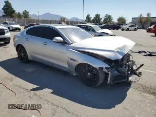 2019 Jaguar XE 25t with VIN SAJAR4FX6KCP49670, listed as a Copart auction lot 75340594 with 71,282 mi miles and Salvage Title. Bid and sale history available at carsss.com. Image 4.