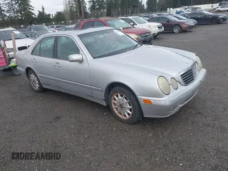 2000 Mercedes-Benz E-Class with VIN WDBJF65J1YB150981, listed as a IAAI auction lot 41568815 with 216,420 mi miles. Bid and sale history available at carsss.com. Image 1.