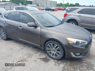 2014 Kia Cadenza Premium z VIN KNALN4D74E5144896, wystawiony jako IAAI lot #42466220 z przebiegiem 157 654 mil mil oraz . Historia ofert i sprzedaży dostępna na DreamBid. Obrazek 1.