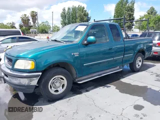 1998 Ford F-150 with VIN 1FTZX1760WKA90900, listed as a IAAI auction lot 42239510 with 198,405 mi miles and . Bid and sale history available at DreamBid. Image 2.