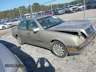 1997 Mercedes-Benz E-Class with VIN WDBJF55F4VA405680, listed as a IAAI auction lot 41462478 with 352,480 mi miles. Bid and sale history available at carsss.com. Image 1.