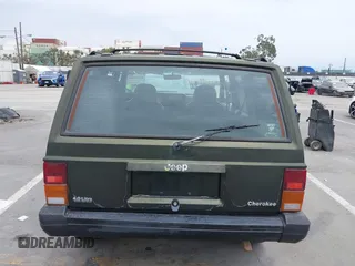 1996 Jeep Cherokee Sport z VIN 1J4FT68S6TL267408, wystawiony jako IAAI lot #42385629 z przebiegiem 268 753 mil mil oraz . Historia ofert i sprzedaży dostępna na DreamBid. Obrazek 16.