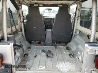 2003 Jeep Wrangler Sport z VIN 1J4FA49S93P306817, wystawiony jako Copart lot #60136385 z przebiegiem 217 208 mil mil oraz Czysty tytuł • Clean title. Historia ofert i sprzedaży dostępna na DreamBid. Obrazek 11.