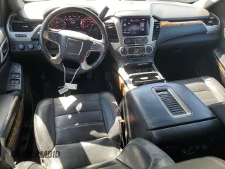 2015 GMC Yukon Denali with VIN 1GKS2CKJ8FR596848, listed as a Copart auction lot 52048105 with 129,935 mi miles and Salvage Title. Bid and sale history available at carsss.com. Image 8.