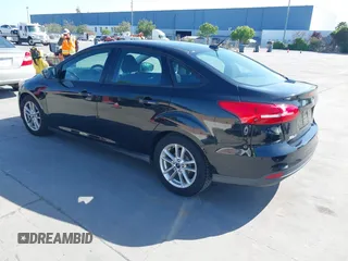 2015 Ford Focus SE with VIN 1FADP3F23FL313614, listed as a IAAI auction lot 42153320 with 121,346 mi miles. Bid and sale history available at carsss.com. Image 3.