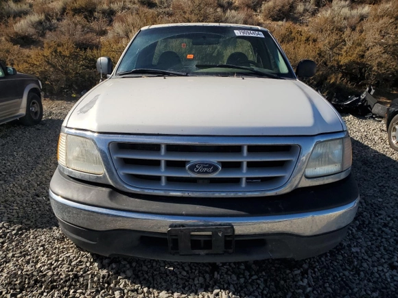 1999 Ford F-150 z VIN 1FTRF18W1XKA87801, wystawiony jako Copart lot #79094454 z przebiegiem Nie podano mil oraz Szkoda całkowita • Salvage title. Historia ofert i sprzedaży dostępna na DreamBid. Obrazek 5.
