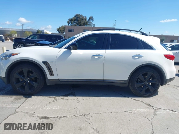 2015 Infiniti QX70 with VIN JN8CS1MU5FM380792, listed as a IAAI auction lot 41946084 with 128,928 mi miles and . Bid and sale history available at DreamBid. Image 14.