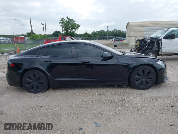 2022 Tesla Model S with VIN 5YJSA1E51NF472152, listed as a IAAI auction lot 42625943 with 60,290 mi miles and . Bid and sale history available at DreamBid. Image 12.