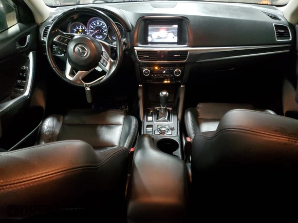 2016 Mazda CX-5 Grand Touring with VIN JM3KE4DY4G0600877, listed as a Copart auction lot 85560194 with 82,395 mi miles and Salvage Title. Bid and sale history available at carsss.com. Image 8.