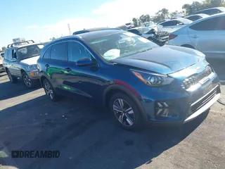 2020 Kia Niro LX with VIN KNDCB3LC4L5443158, listed as a IAAI auction lot 41248943 with 76,473 mi miles and . Bid and sale history available at DreamBid. Image 1.