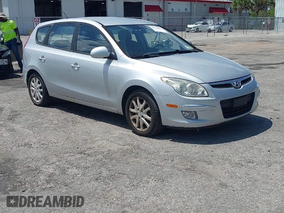 2009 Hyundai Elantra Touring with VIN KMHDC86E99U035163, listed as a IAAI auction lot 42049897 with 123,559 mi miles and . Bid and sale history available at DreamBid. Image 1.