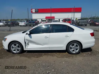 2014 Volkswagen Jetta TDI w/Premium/Nav with VIN 3VWLL7AJXEM366828, listed as a IAAI auction lot 42392563 with 132,924 mi miles and . Bid and sale history available at DreamBid. Image 14.