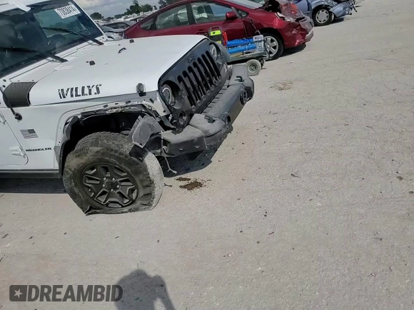 2016 Jeep Wrangler Willys Wheeler z VIN 1C4AJWAG7GL297695, wystawiony jako Copart lot #70838414 z przebiegiem 82 813 mil mil oraz Szkoda całkowita • Salvage title. Historia ofert i sprzedaży dostępna na DreamBid. Obrazek 11.