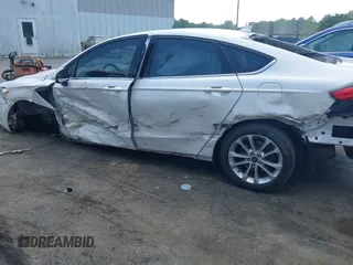 2020 Ford Fusion SE z VIN 3FA6P0LU5LR153942, wystawiony jako IAAI lot #42145638 z przebiegiem 99 961 mil mil oraz . Historia ofert i sprzedaży dostępna na DreamBid. Obrazek 6.
