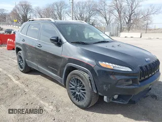 2015 Jeep Cherokee North with VIN 1C4PJMCS7FW544792, listed as a IAAI auction lot 41801573 with 140,575 mi miles. Bid and sale history available at carsss.com. Image 1.