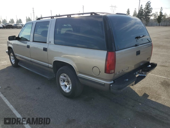 1999 GMC Suburban with VIN 3GKEC16R0XG526194, listed as a Copart auction lot 83740634 with 199,583 mi miles and Clean title. Bid and sale history available at DreamBid. Image 2.