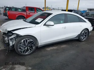 2023 Hyundai IONIQ 6 SEL with VIN KMHM34AA9PA034042, listed as a IAAI auction lot 41194785 with 13,168 mi miles. Bid and sale history available at carsss.com. Image 2.