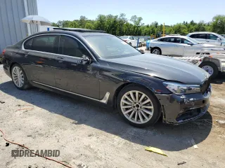 2017 BMW 7 Series 740i z VIN WBA7E2C30HG741105, wystawiony jako Copart lot #56632005 z przebiegiem 95 162 mil mil oraz Czysty tytuł • Clean title. Historia ofert i sprzedaży dostępna na DreamBid. Obrazek 4.