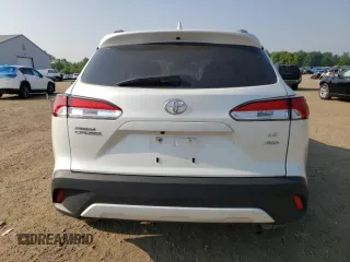 2023 Toyota Corolla Cross LE with VIN 7MUCAABG3PV060880, listed as a Copart auction lot 59664915 with 18,246 mi miles and Salvage title. Bid and sale history available at DreamBid. Image 6.