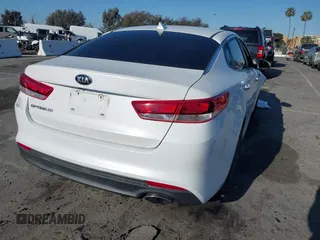 2016 Kia Optima LX with VIN 5XXGT4L33GG014082, listed as a IAAI auction lot 41870030 with 137,849 mi miles and . Bid and sale history available at DreamBid. Image 4.