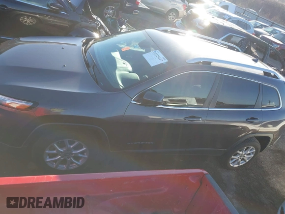 2016 Jeep Cherokee Altitude with VIN 1C4PJLCS8GW173279, listed as a IAAI auction lot 41129117 with 163,978 mi miles. Bid and sale history available at carsss.com. Image 14.