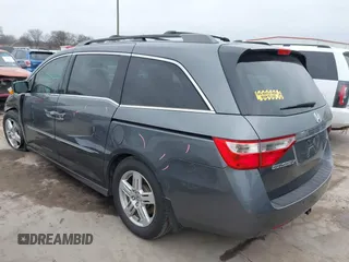 2012 Honda Odyssey Touring with VIN 5FNRL5H96CB138548, listed as a IAAI auction lot 41471856 with 186,284 mi miles and . Bid and sale history available at DreamBid. Image 3.