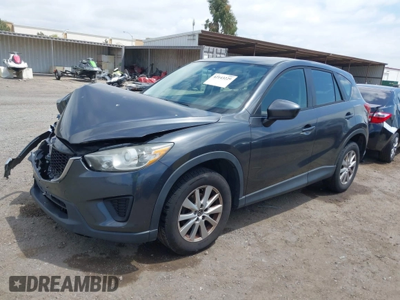 2014 Mazda CX-5 Sport with VIN JM3KE2BE0E0411377, listed as a IAAI auction lot 42143229 with 137,384 mi miles and . Bid and sale history available at carsss.com. Image 2.