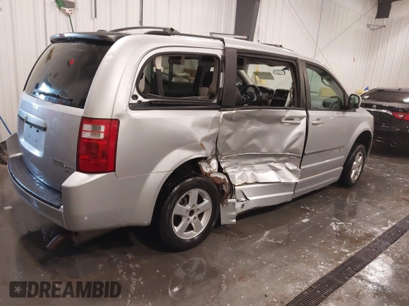 2010 Dodge Grand Caravan SXT with VIN 2D4RN5D15AR261319, listed as a IAAI auction lot 41877022 with 142,292 mi miles and . Bid and sale history available at DreamBid. Image 4.