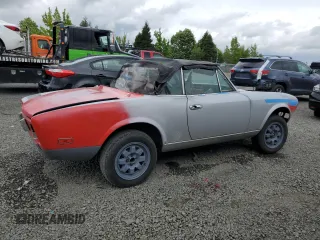 1979 FIAT 124 Spider z VIN 124CS20143220, wystawiony jako Copart lot #58174785 z przebiegiem 41 761 mil mil oraz Tytuł czysty. Historia ofert i sprzedaży dostępna na DreamBid. Obrazek 3.
