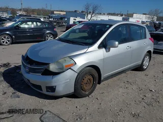 2009 Nissan Versa 1.8 SL with VIN 3N1BC13E09L393563, listed as a IAAI auction lot 41977998 with 163,072 mi miles. Bid and sale history available at carsss.com. Image 2.