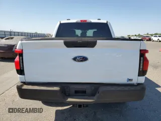 2023 Ford F-150 Lightning Pro with VIN 1FT6W1EVXPWG44972, listed as a Copart auction lot 60303485 with 19,788 mi miles and Salvage title. Bid and sale history available at DreamBid. Image 6.