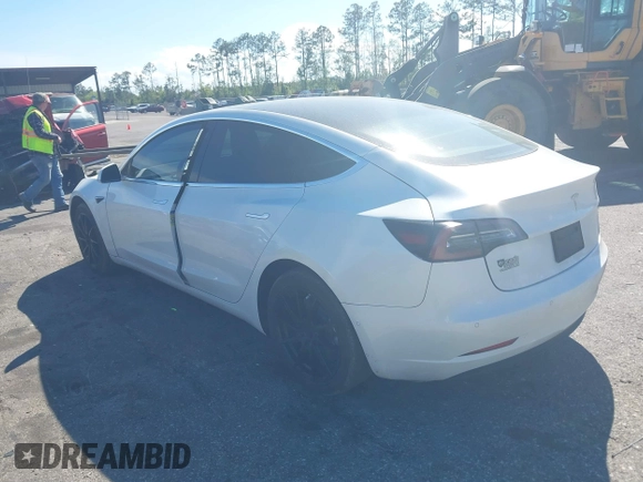 2019 Tesla Model 3 Mid Range with VIN 5YJ3E1EA7KF425127, listed as a IAAI auction lot 41886436 with 87,236 mi miles and . Bid and sale history available at carsss.com. Image 3.