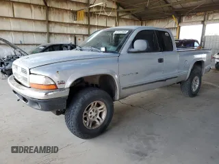 1999 Dodge Dakota SLT with VIN 1B7GG22Y0XS259031, listed as a Copart auction lot 87972505 with 153,354 mi miles and Salvage Title. Bid and sale history available at carsss.com. Image 1.