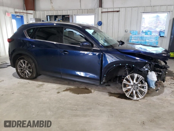 2021 Mazda CX-5 Grand Touring with VIN JM3KFBDM3M0327635, listed as a Copart auction lot 49980635 with 47,160 mi miles and Salvage Title. Bid and sale history available at carsss.com. Image 4.