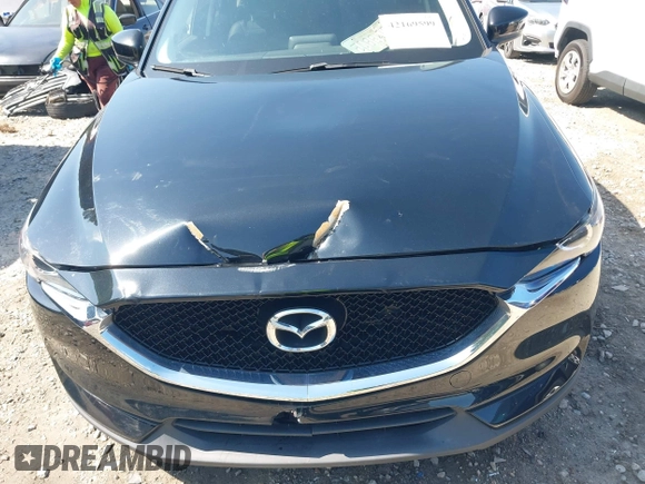 2017 Mazda CX-5 Touring z VIN JM3KFBCL0H0209458, wystawiony jako IAAI lot #42169599 z przebiegiem 93 287 mil mil oraz . Historia ofert i sprzedaży dostępna na DreamBid. Obrazek 17.