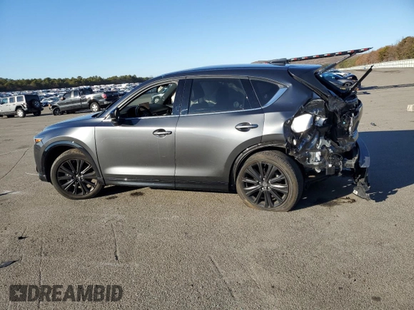 2022 Mazda CX-5 2.5 Turbo with VIN JM3KFBAY2N0596945, listed as a Copart auction lot 86427694 with Not Provided miles and Salvage Title. Bid and sale history available at carsss.com. Image 2.