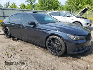 2016 BMW 7 Series 740i with VIN WBA7E2C56GG738788, listed as a Copart auction lot 60654015 with 96,059 mi miles and Clean title. Bid and sale history available at DreamBid. Image 4.