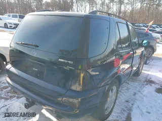 2001 Mercedes-Benz M-Class AMG with VIN 4JGAB74E71A255572, listed as a IAAI auction lot 41415938 with 78,185 mi miles. Bid and sale history available at carsss.com. Image 4.