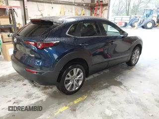 2022 Mazda CX-30 S Select z VIN 3MVDMBBL0NM440747, wystawiony jako IAAI lot #41864038 z przebiegiem 9667 mil mil oraz . Historia ofert i sprzedaży dostępna na DreamBid. Obrazek 4.