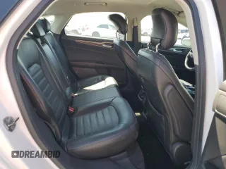 2013 Ford Fusion SE Hybrid z VIN 3FA6P0LU6DR325719, wystawiony jako Copart lot #55777715 z przebiegiem 152 478 mil mil oraz Szkoda całkowita • Salvage title. Historia ofert i sprzedaży dostępna na DreamBid. Obrazek 10.