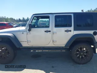 2008 Jeep Wrangler Unlimited X with VIN 1J4GA39148L596727, listed as a IAAI auction lot 42632457 with 175,000 mi miles and . Bid and sale history available at DreamBid. Image 14.