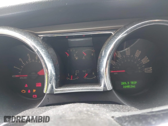 2005 Ford Mustang Deluxe z VIN 1ZVFT80N655234887, wystawiony jako IAAI lot #42521363 z przebiegiem 164 011 mil mil oraz . Historia ofert i sprzedaży dostępna na DreamBid. Obrazek 7.