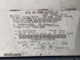 2013 Ford Taurus SEL with VIN 1FAHP2E81DG129229, listed as a IAAI auction lot 41999326 with 205,856 mi miles. Bid and sale history available at carsss.com. Image 9.
