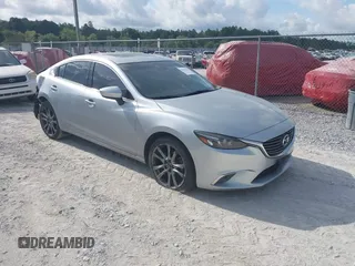 2016 Mazda 6 i Grand Touring with VIN JM1GJ1W59G1450027, listed as a IAAI auction lot 42347357 with 120,863 mi miles and . Bid and sale history available at DreamBid. Image 1.