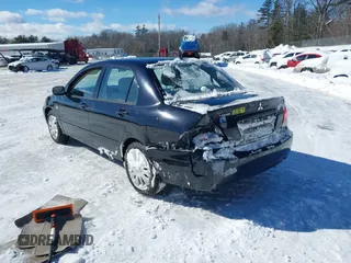 2006 Mitsubishi Lancer ES with VIN JA3AJ26E06U000385, listed as a IAAI auction lot 41587490 with 185,100 mi miles. Bid and sale history available at carsss.com. Image 3.