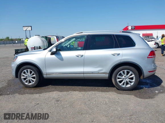 2014 Volkswagen Touareg Sport with VIN WVGEF9BP6ED007436, listed as a IAAI auction lot 41953307 with 114,925 mi miles and . Bid and sale history available at DreamBid. Image 14.