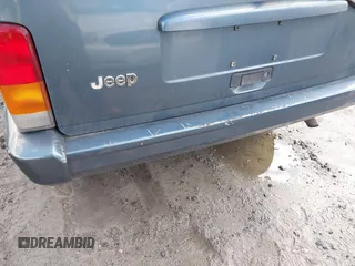 1998 Jeep Cherokee Sport with VIN 1J4FT68S0WL125382, listed as a IAAI auction lot 41551866 with 1 mi miles. Bid and sale history available at carsss.com. Image 6.