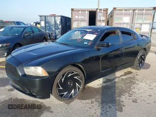 2013 Dodge Charger SE with VIN 2C3CDXBG5DH535058, listed as a IAAI auction lot 42101566 with 205,790 mi miles and . Bid and sale history available at DreamBid. Image 2.