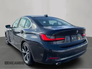 2021 BMW 3 Series 330i with VIN 3MW5R1J04MBB48483, listed as a Copart auction lot 50515195 with 128,555 mi miles and Clean Title. Bid and sale history available at carsss.com. Image 3.